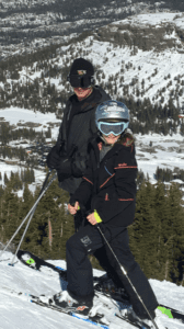 Curtis skiing with daughter