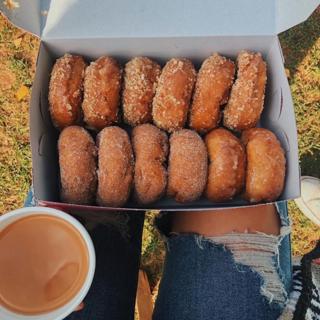 inline image showing a Box of apple cider donuts and coffee from Rainbow Orchards, part of Apple Hill in Orchard in El Dorado County, California