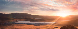 Featured image showing Panasonic Energy outside of Sparks Nevada with the sunrise coming over the hill.