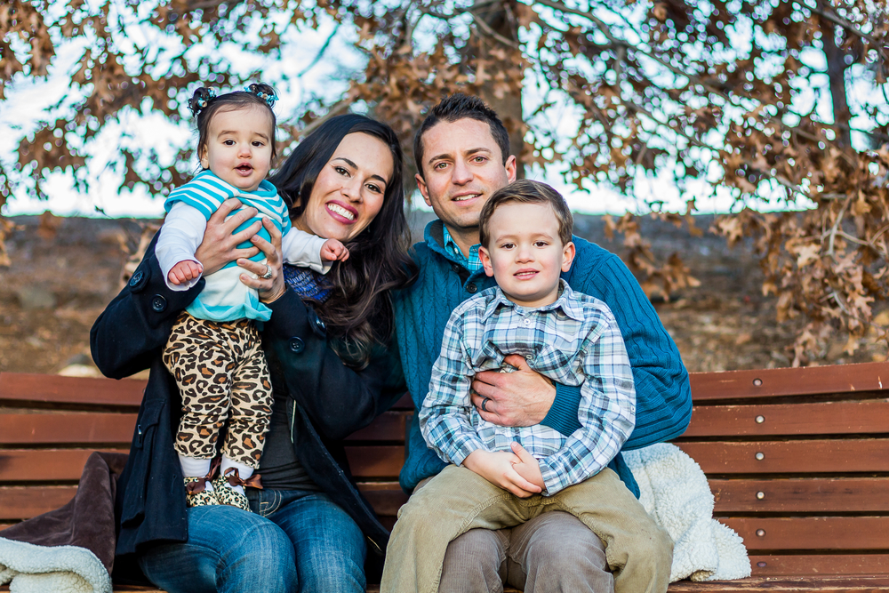 Featured image showing a family posing for a picture on a park bench in Reno, Nevada.