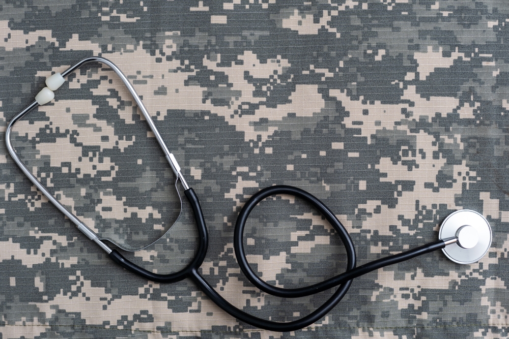 Featured image showing Stethoscope lies on the uniform of a US soldier