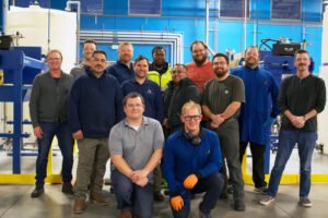 Featured image showing a group of Aqua Metals employees on a tour of their modern facility with elected officials.