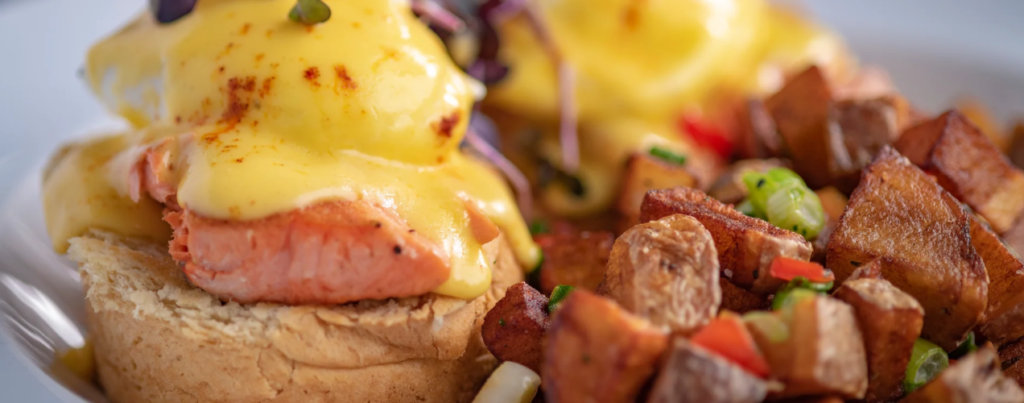 Inline image showing a locally sourced breakfast from Homegrown Gastro Pub in Reno, Nevada. Country potatoes and salmon eggs benedict. 